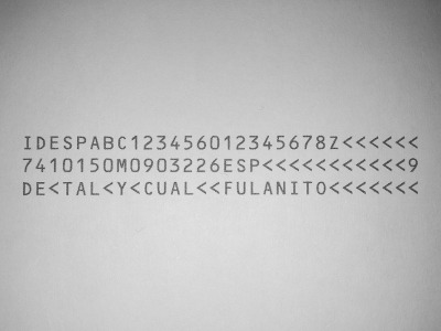[Grayscale photo of the OCR data lines of a made up
DNI]
